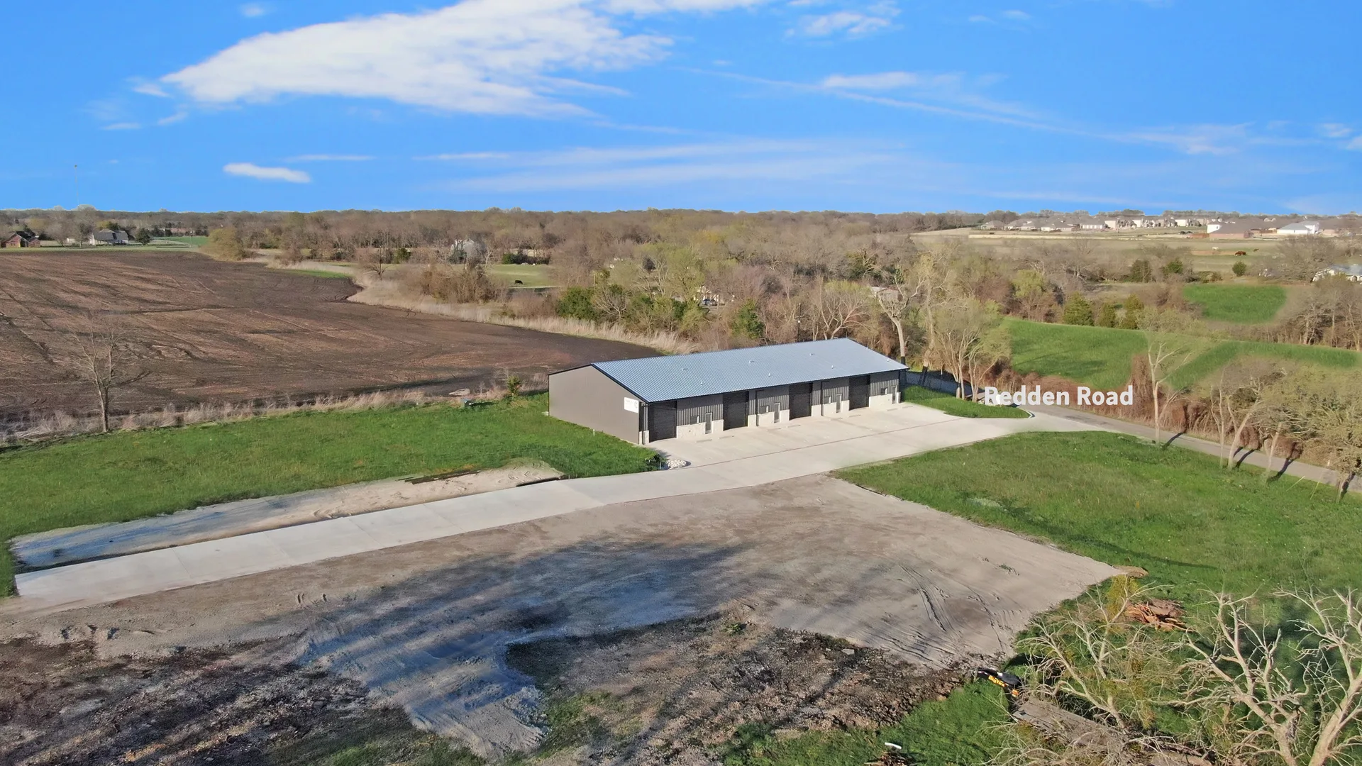 Aerial view of Triple C Business Park on Redden Road with the building, yard, access road, and surrounding North Texas land